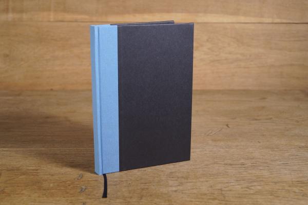 Writing and notebook black, with light blue linen